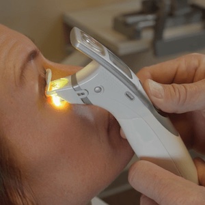 Systane iLux in use on a patient